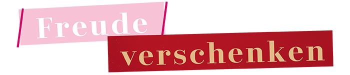 Der Schriftzug “Freude verschenken” auf einem Hintergrund in Rosa und Rot