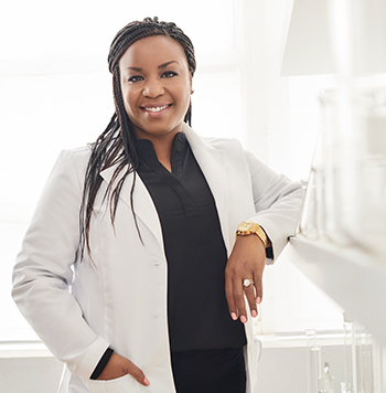 Dr. Shoná Burkes-Henderson, Associate Principal Scientist, a black female scientist, smiling in a scientific setting