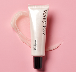 Mary Kay Foundation Primer With SPF 15 on a pink background with a translucent smear of the primer