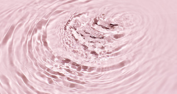 Rosafarbene Wassertropfen, die für Feuchtigkeitsversorgung bei trockener Haut stehen