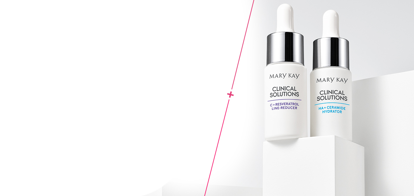 Die neuen Clinical Solutions Booster von Mary Kay bringt Ihre Hautpflegeroutine auf das nächste Level. Die zwei weißen Fläschchen stehen zusammen auf einem weißen Podest vor einem grauen Hintergrund.