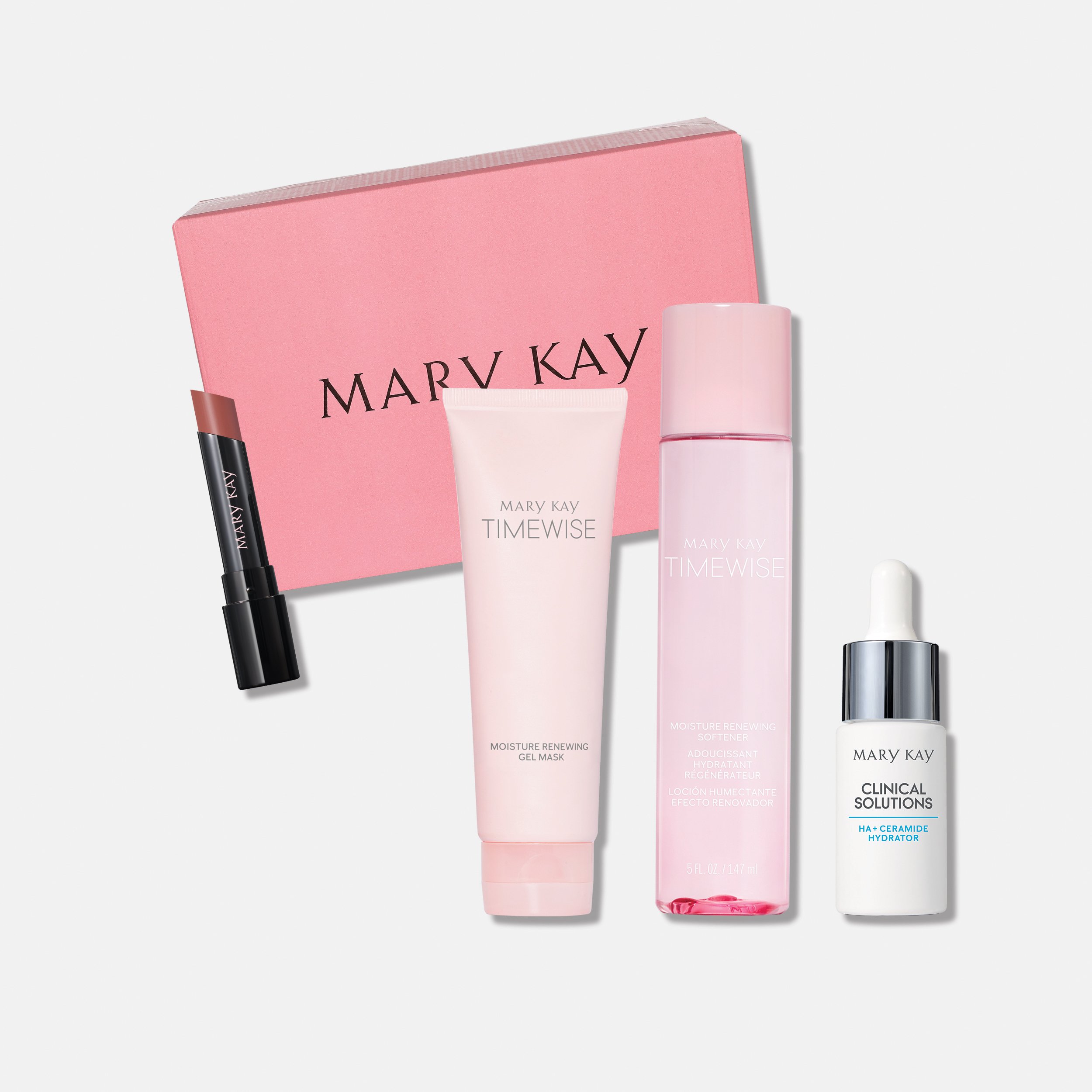 Rosa Summer Beauty Box mit Produkten und gratis Lippenstift, arrangiert auf weißem Hintergrund.