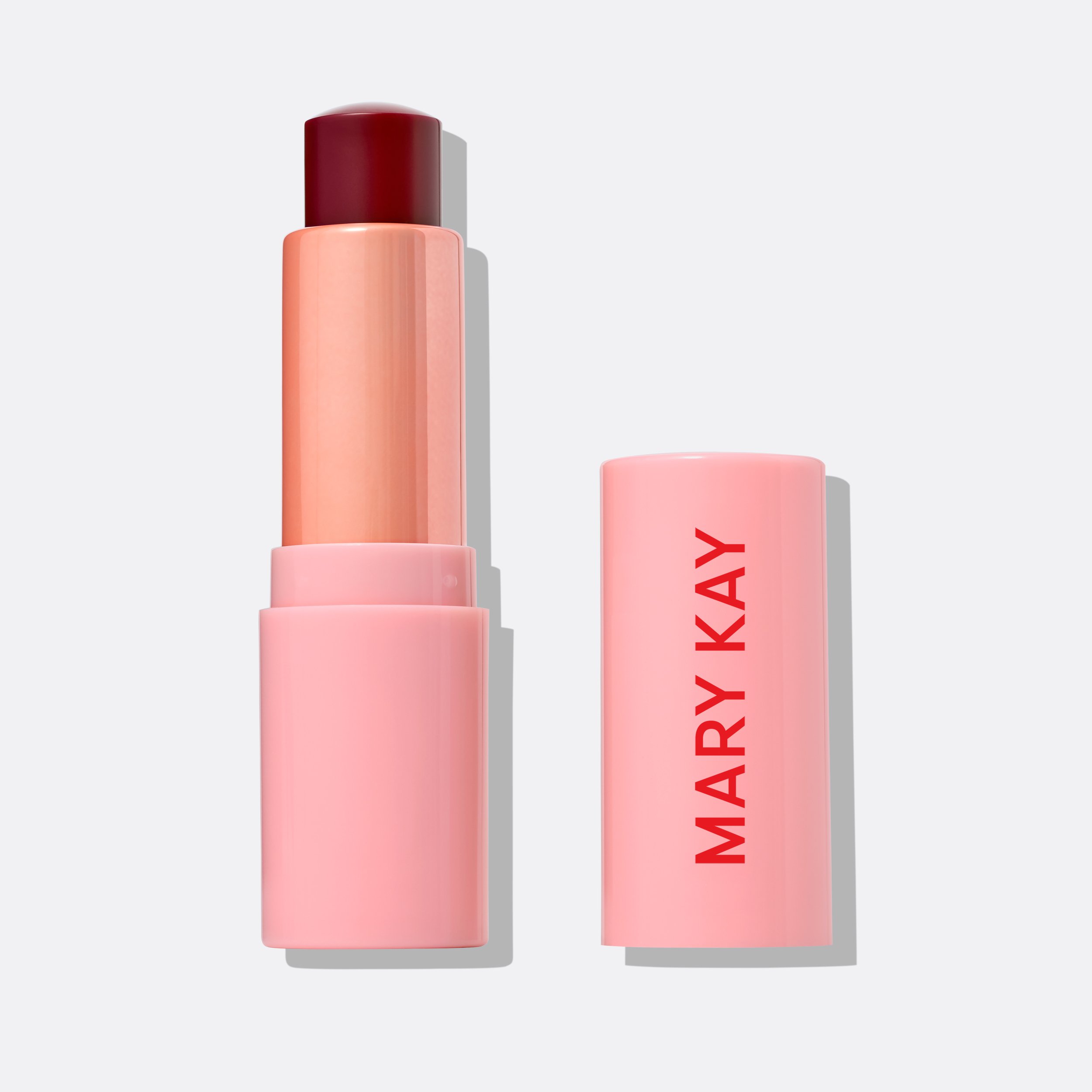 Geöffneter Mary Kay Tinted Lip Balm in Radiant Pink auf weißem Hintergrund
