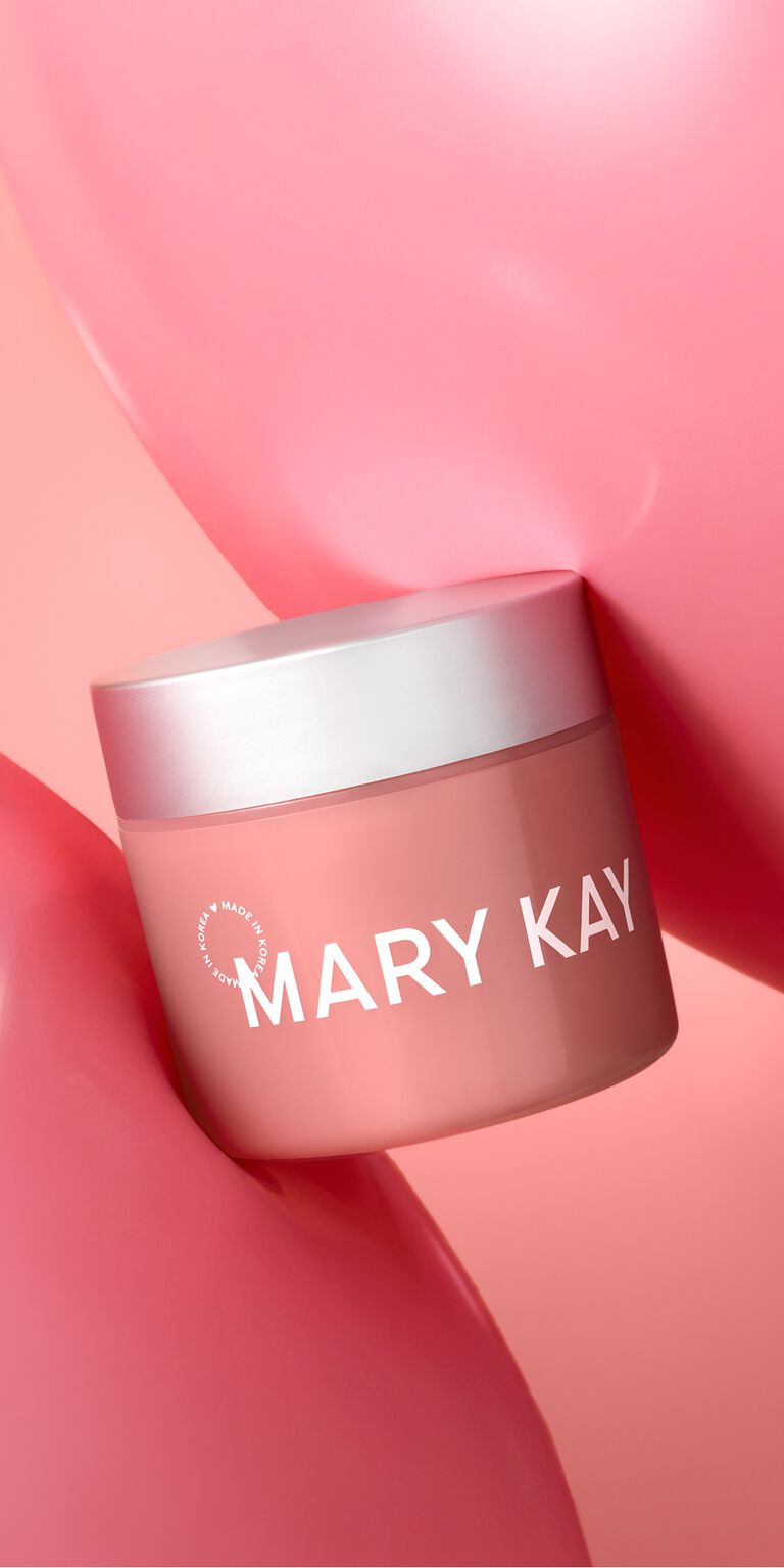 Der Tiegel des Mary Kay&reg; Collagen Moisturizing Gel zwischen zwei rosa Gel-Texturen