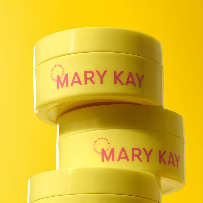 Drei &uuml;bereinandergestapelte gelbe Tiegel der Mary Kay&reg; Snail Gel Face Patches