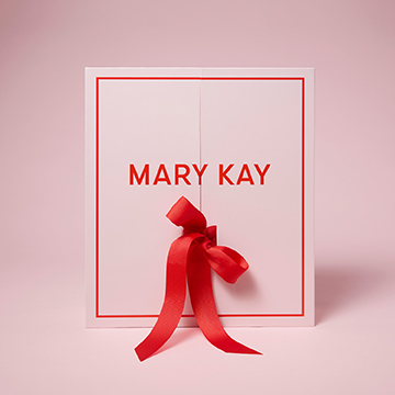 Ein rosa Adventskalender von Mary Kay mit roter Schleife (zugeklappt)